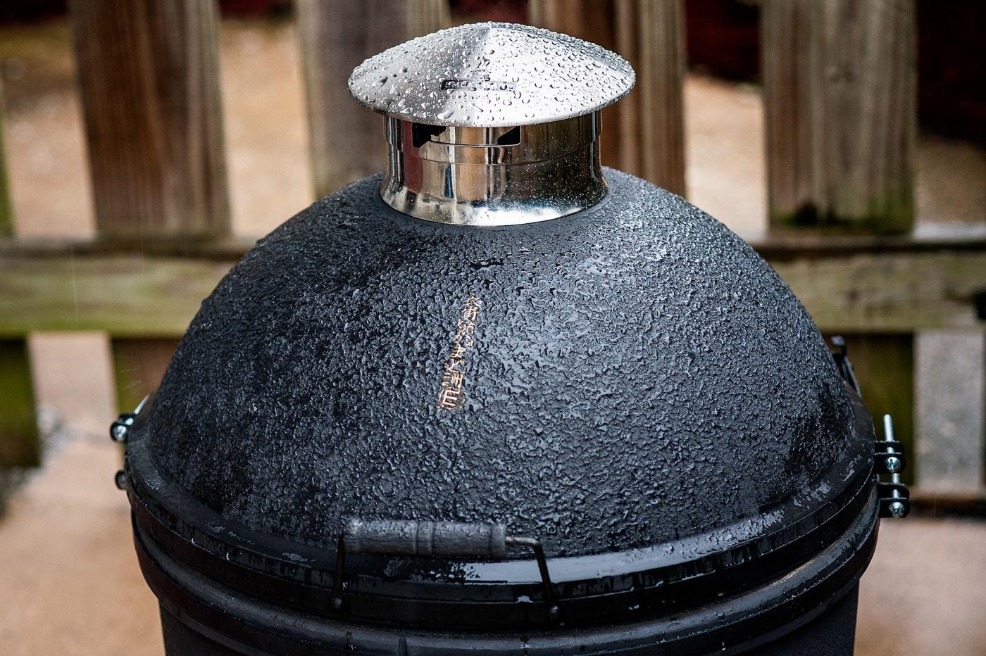 The Restoration of an Antique Kamado by Kinuura Yaki Pottery of Japan. With Smokeware Chimney Cap in the rain